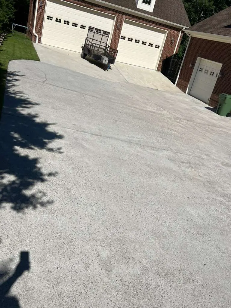 Clean, bright concrete driveway after pressure washing